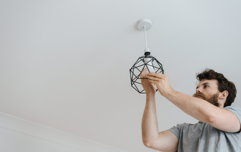 man changing a lightbulb