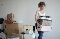 woman carrying things and organizing them